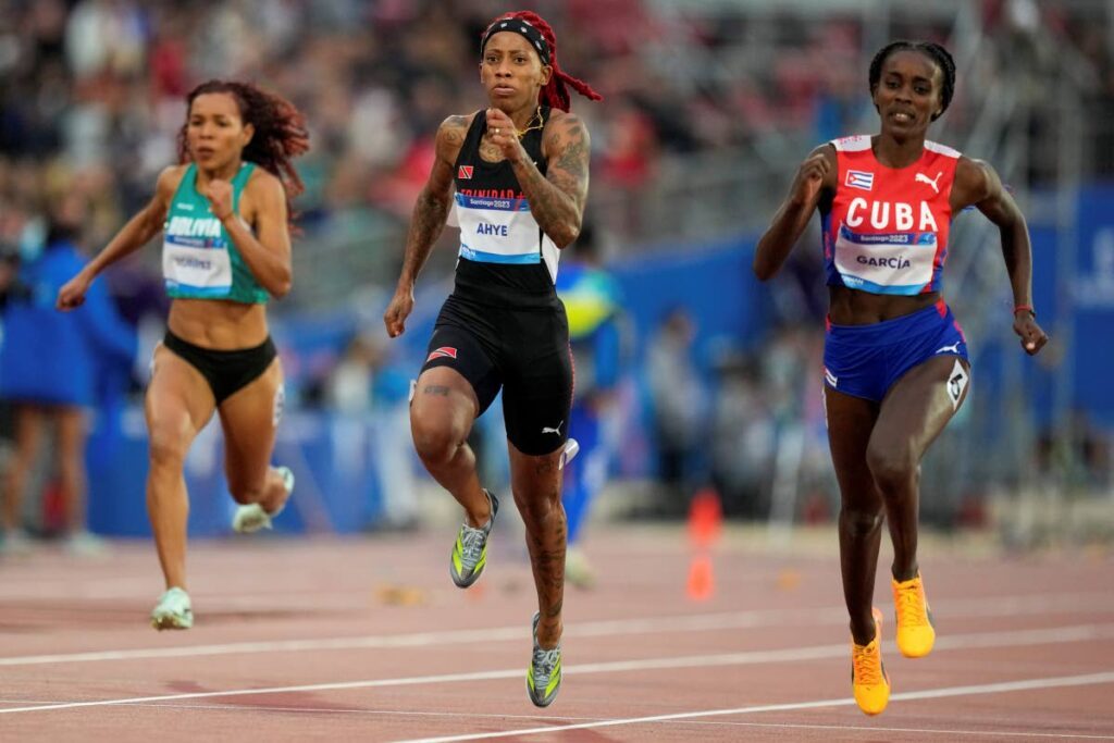 Cuba's Yunisleidy Garcia and TT's Michelle-lee Ahye run in a women's 100m semifinal at the Pan American Games in Santiago, Chile, on Monday. - AP PHOTO (Image obtained at newsday.co.tt)
