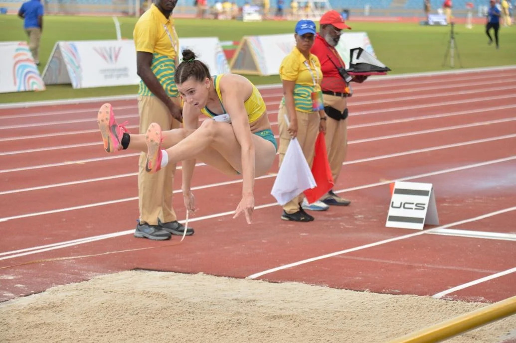 GOLD STRIKE: Australian Delta Amidzovski leaps to a new Games record of 6.34 metres to claim gold in the women’s long jump, yesterday, at the Hasely Crawford Stadium as the first day of the athletics segment in the Trinbago 2023 Commonwealth Youth Games, got under way. —Photo: ROBERT TAYLOR (Image obtained at trinidadexpress.com)