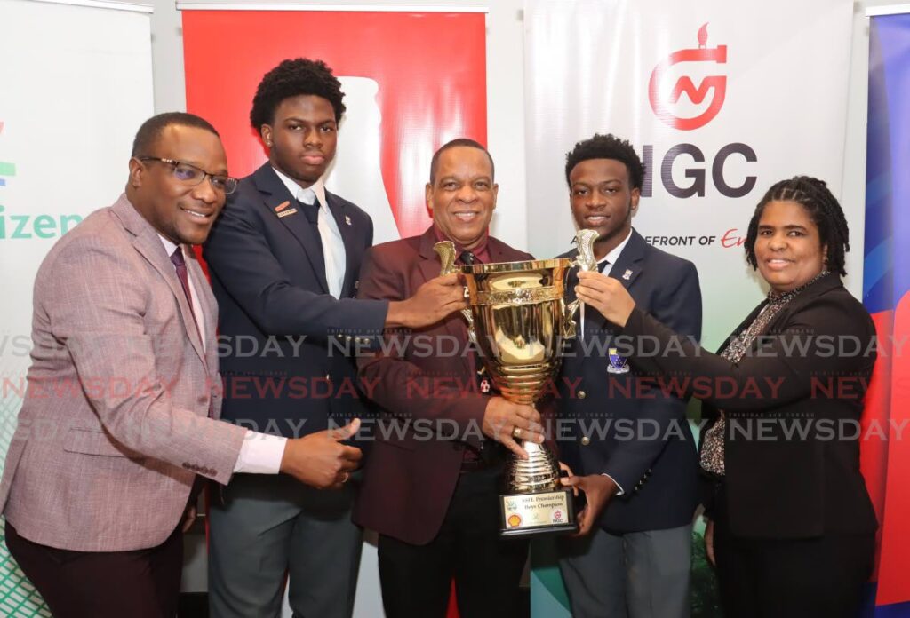 From left, David Roberts, acting permanent secretary, Ministry of Sports and Community Development; Fatima College defender Yohance Atherton; president of the Secondary School Football League (SSFL) Merere Louis Gonzales; Fatima College midfielder Jedaiah King; acting permanent secretary, Ministry of Education Simone Wiliams, at the SSFL launch at The Brix St Ann's, Port of Spain on August 28. - Photo by Faith Ayoung (Image obtained at newsday.co.tt)