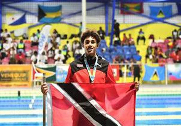 GOLDEN: T&T’s Liam Carrington at last year’s Carifta Aquatics Championships in Curacao. (Image obtained at trinidadexpress.com)