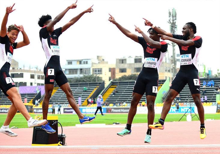 CELEBRATION: Dylan Woodruffe, left, Hakeem Chinapoo, Kadeem Chinapoo and Che Wickham celebrate Trinidad and Tobago’s qualification for the World Athletics U20 Championship men’s 4x100 metres final in Lima, Peru, yesterday. The championship race will be contested at 6.50 this evening (T&T time). —Photo: BAHAMAS ATHLETICS/KERMIT TAYLOR (Image obtained at trinidadexpress.com)