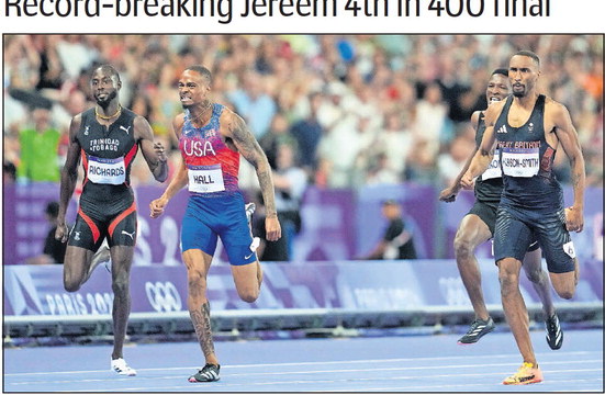 WINNER: Quincy Hall, of the United States, crosses the finish line ahead of Matthew Hudson-Smith, of Britain, right, and Jereem Richards, left, of Trinidad and Tobago, to win the men's 400 metres final, at the 2024 Summer Olympics, yesterday in Saint-Denis, France. -Photo: AP (Image obtained at rinidadexpress-tto.newsmemory.com)