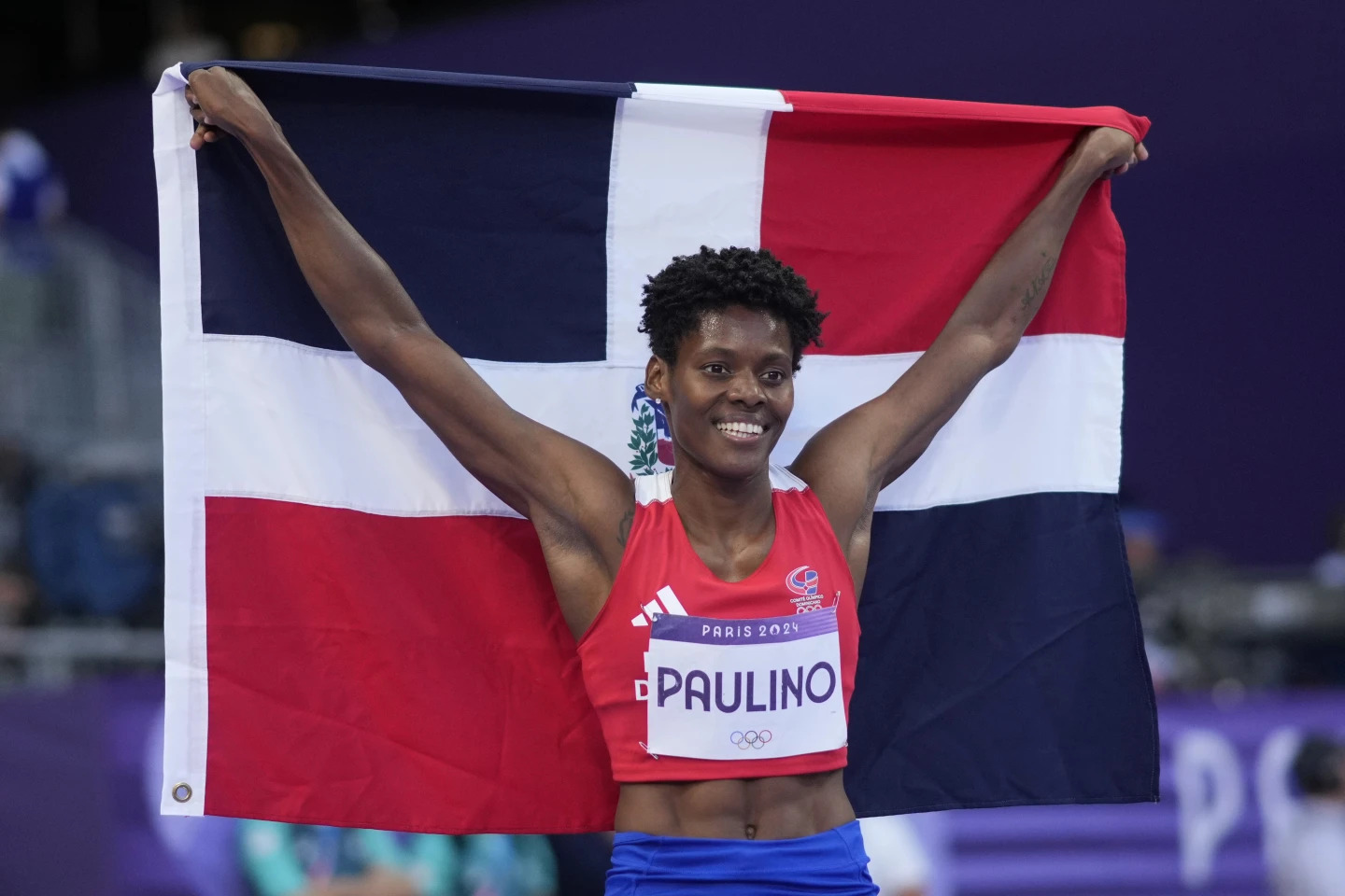 Marileidy Paulino, of the Dominican Republic, celebrates winning the women’s 400-meter final at the 2024 Summer Olympics, Friday, Aug. 9, 2024, in Saint-Denis, France. (AP Photo/Bernat Armangue) (Image obtained at apnews.com)