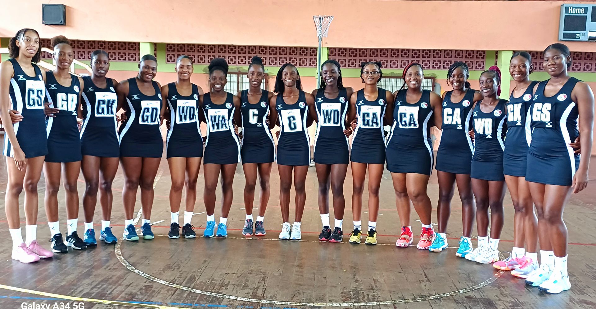 National Under-21 netballers, Shaniya Morgan, from left, Kerlene Johnson, Nekesha Gomes, captain Destiny Williams, Jenecia Goodridge, Kayleea Songui, Neisha Hyles, Shian Lewis, Xhane’ Gray, Jelisia Goodrige, Katty Ann Graham, Jada Hamilton, N’zinga Charles, Nichola Gill, and Maikea Bramble, who placed third at the Americas Qualifiers for the 2025 Netball Youth World Cup in Guadeloupe, during a photo shoot at St Paul Street Complex in Port-of-Spain on June 19. Yesterday, T&T defeated Grenada, 61-39, to qualify for the NWYC.  Clayton Clarke (Image obtained at guardian.co.tt)
