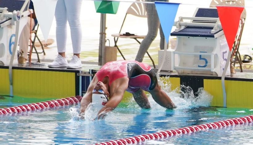 Ornella Walker en route to 18 and over 100 metre backstroke Gold at the 2022 PAN AM Aquatics Age Group Swimming Championships in Trinidad and Tobago. Photo courtesy of Daniel Prentice (Image obtained at draftingthecaribbean.wordpress.com)